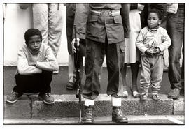 Black children and white soldier at the opening of Parliament ceremony in Cape Town