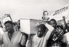 Mourners carry the coffin of assassinated human rights activist David Webster at his funeral atte...