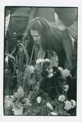 A members of JODAC places flowers in Alex to commemorate the "Alexandra massacre"