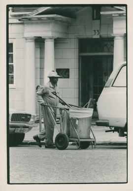 Municipal workers collecting refuse.