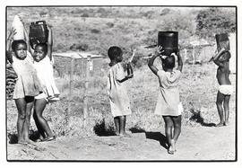 Children carrying water in Ntabanana, relocation area near Empangeni
