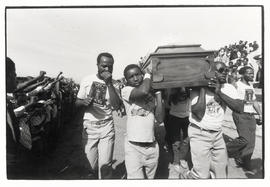 Activists carry the coffin at the funeral of a victim of the recent unrest in Port Elizabeth