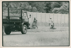 Municipal workers mowing