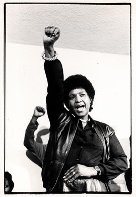 Winnie Mandela (with raised fist) at the memorial service for Ben Moloise (executed ANC guerilla)