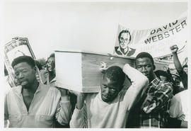 Pallbearers carrying David Websters coffin.