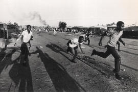 Youth flee from troops during clashes in the East Rand township of Duduza