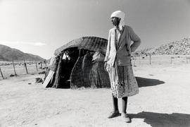 A woman subsistance farmer stands outside her house in the coloured reserve of Leliefontein, Nama...