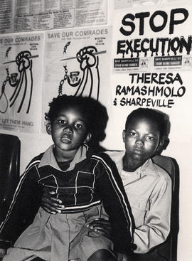 Stop execution - The children of one of the 'Sharpeville Six' look on at a meeting called for the...