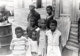 Children in front of their shack in Peddie Resettlement Camp