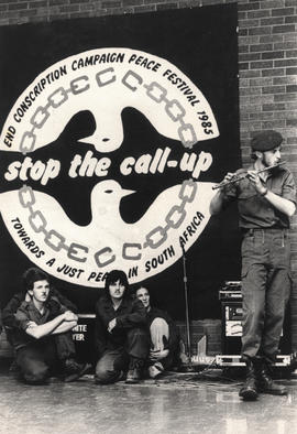 "Stop the call-up" Flute-playing soldier at a meeting of the End Conscription Campaign ...