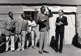 A school is opened in Rooigrond, a resettlement camp. John Lalola speaks. Dr. Kistner of the SACC...