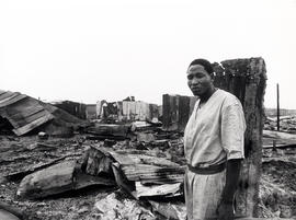 A resident of KTC squatter camp, Cape Town with the remnants of his shack in which his family was...