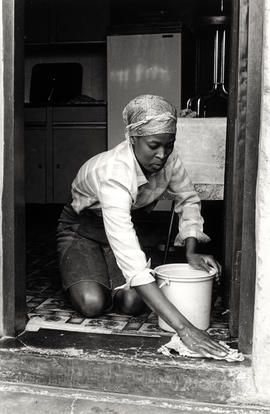 Domestic servant Motlajo polishes the floor in Tembisa, East Rand (Transvaal)5 May 1985