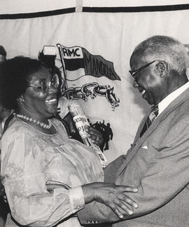 Govan Mbeki greets Mrs. June Mlangeni, wife of Rivonia Trialist Andrew Mlangeni