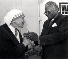 Mother Teresa briefly meets Anglican Archbishop Desmond Tutu at a special lunch in her honour in ...
