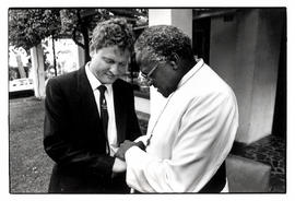Archbishop Tutu and conscientious objector Ivan Toms pray together shortly after Toms was granted...