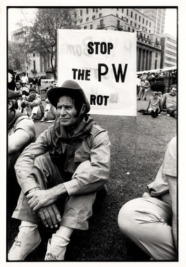 Stop the PW rot - AWB supporter with his protest placard behind him at the CP rally in Church Square
