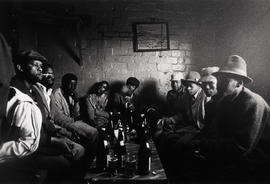 Migrant workers drinking in a township shebeen in South Africa