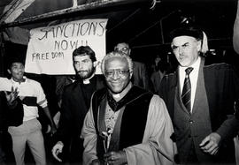 Archbishop Desmond Tutu leads a ceremonial procession prior to his inauguration as Chancellor of ...