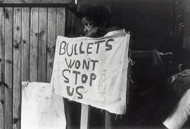 "Bullets won't stop us" - one of the slogans at a June 16 Soweto 1976 commemmoration ra...