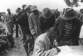 Joseph Kgatitsoe, one of the Mogopa leaders, signs the petition against their forced removal to B...