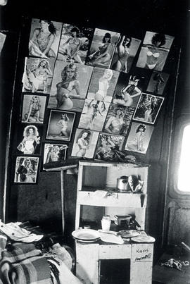 Pictures of white pin-ups on the wall in a migrant workers hostel (for men only) in KTC, one of C...
