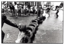 Youth set up tyre barricades in the street in continued defiance of the September 6 elections