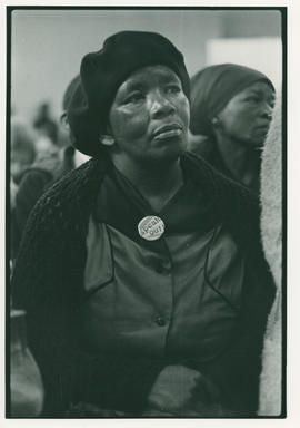 Woman at a political meeting