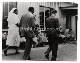 Security Police bringing Robert Sobukwe to a clinic in Soweto to fetch house keys from Veronica (...