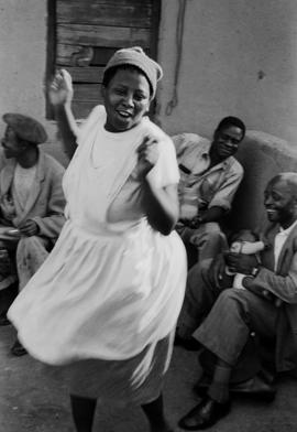 Woman dancing in shebeen