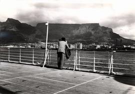 Passenger looking from board a ship towards Table Mountain
