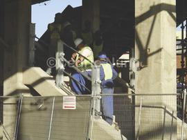 Construction workers revamping railway station. Durban, KwaZulu Natal