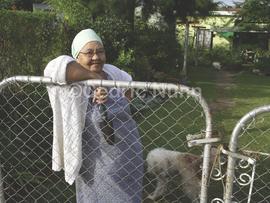 Caroline Manneson at the gate of her RDP house. Eshowe, kwaZulu Natal