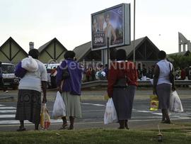 Workers converge on the taxi rank for their commute home. Ballito, KwaZulu Natal