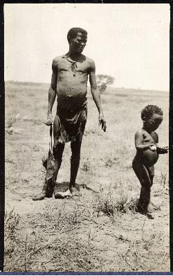 Bushman standing next to a child, Nossop