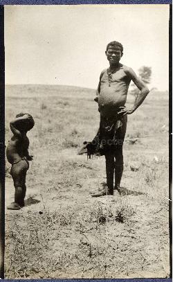 A Bushman standing next to a child, Nossop