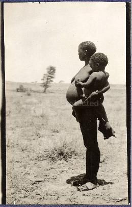 Bushman woman carrying her child at Nossop